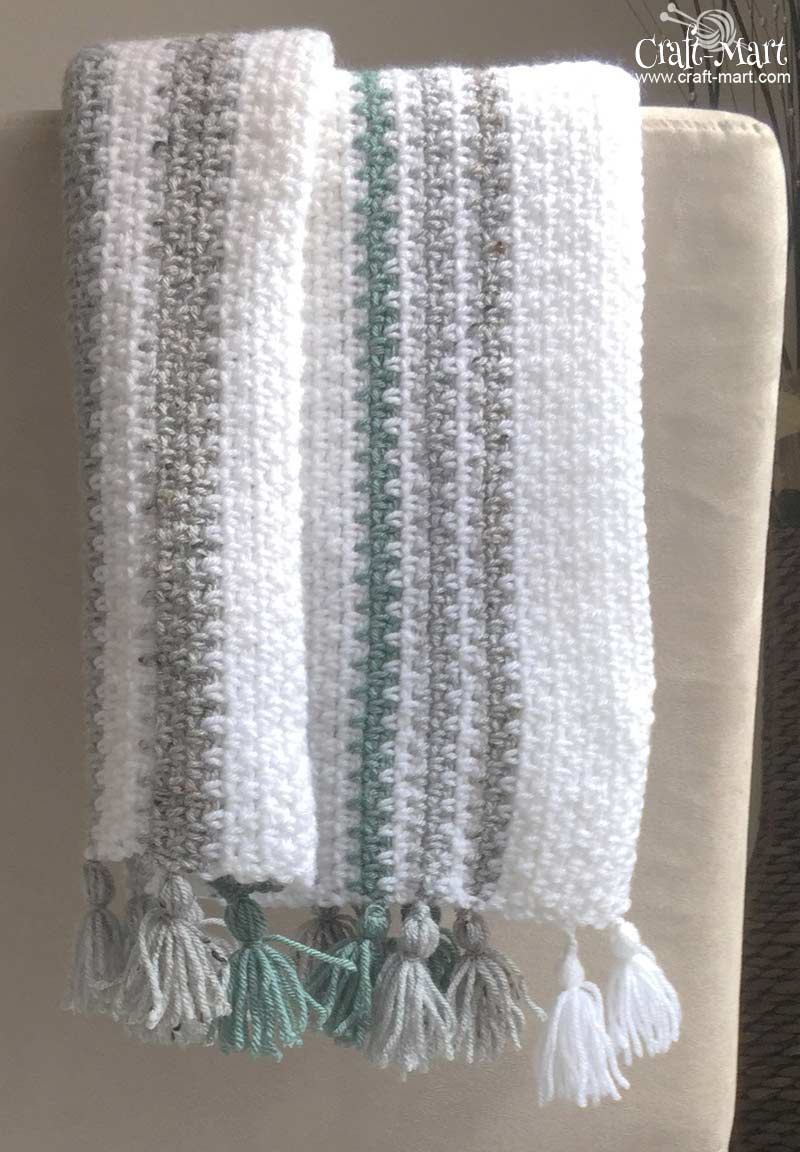 how to crochet a blanket - an overview of easy crochet baby blanket pattern with DIY tassels (finished)