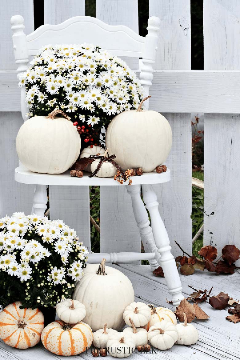 small front porch decorating ideas - white pumpkins in a variety of sizes and a few buckets of white mums will complete this easy DIY fall porch decor project. #frontporchideas #outdoorfalldecoratingideas #smallfrontporchdecoratingideas