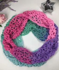 Learn to crochet lacy spring-time infinity scarf with our FREE PATTERN